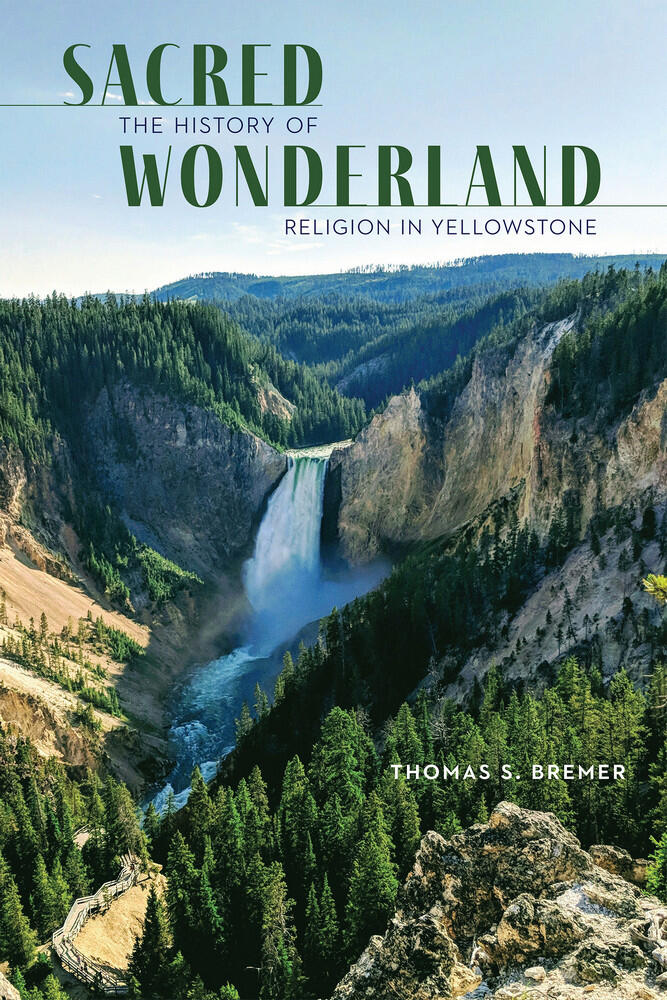 Cover-Sacred Wonderland book Book cover with an image of a waterfall in a large canyon. Title reads Sacred Wonderland the history of religion in Yellowstone Thomas S. Bremer.